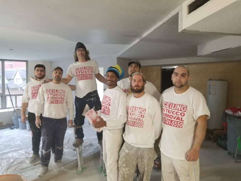A group of ceiling specialists working in a home 