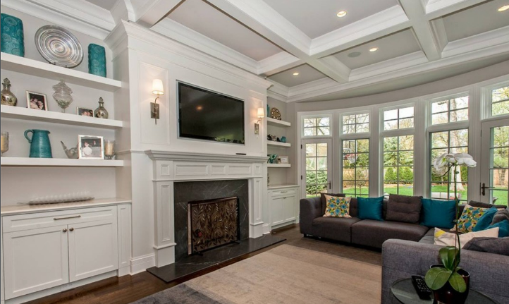 An image of a living room with crown moulded ceiling